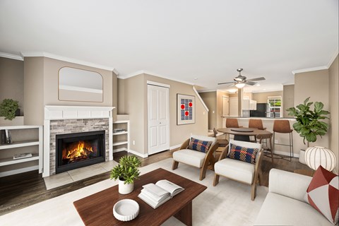 A living room with a fireplace and a painting on the wall.